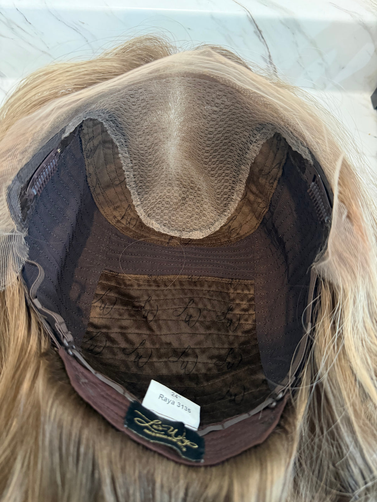 <b>Raya</b><br><u>L</u> <br> <l>Signature Mongolian Collection</l> <br> 24” Lace Top Wig